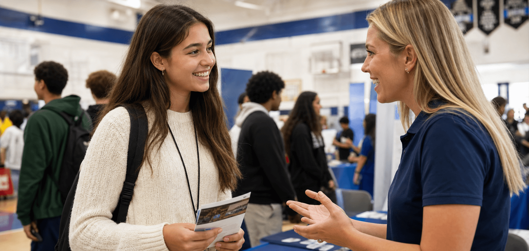 A student speaking with a career representative at a local event